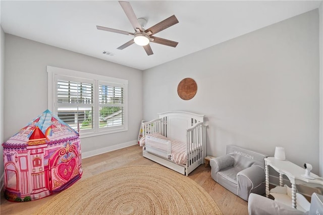 1010 Fendley St, Woodstock, GA 30188 - bedroom with baseboards, a ceiling fan, and wood finished floors