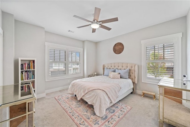 1010 Fendley St, Woodstock, GA 30188 - carpeted bedroom with multiple windows, baseboards, and ceiling fan