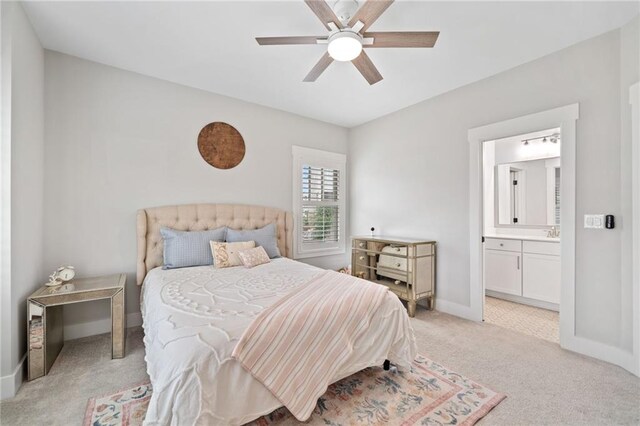 1010 Fendley St, Woodstock, GA 30188 - bedroom with light carpet, baseboards, a sink, ensuite bathroom, and a ceiling fan