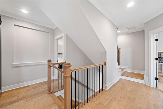 1010 Fendley St, Woodstock, GA 30188 - hallway featuring wood finished floors, recessed lighting, baseboards, and an upstairs landing