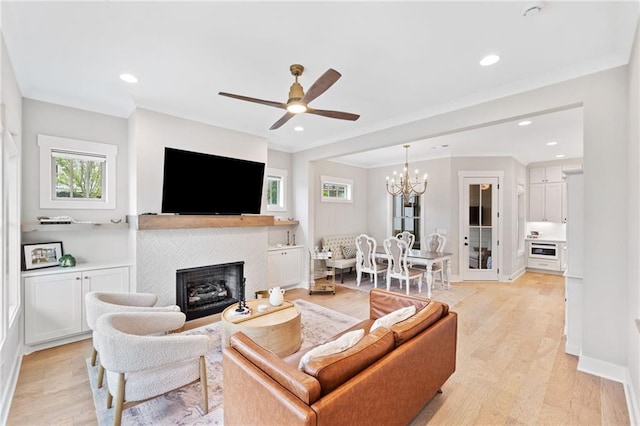1010 Fendley St, Woodstock, GA 30188 - living room featuring plenty of natural light, light wood-style floors, a fireplace, and recessed lighting