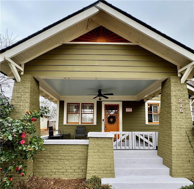 doorway to property with ceiling fan and covered porch