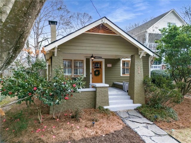 bungalow-style house with a porch and ceiling fan