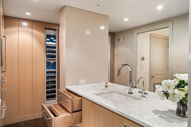 bathroom with hardwood / wood-style flooring and vanity