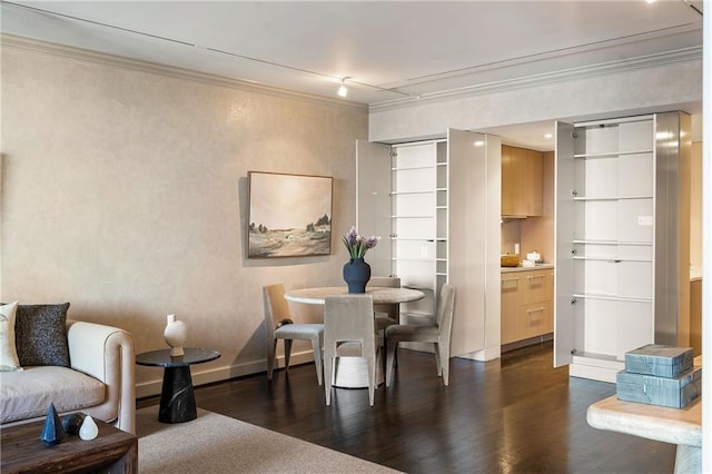 dining room featuring ornamental molding and dark hardwood / wood-style flooring