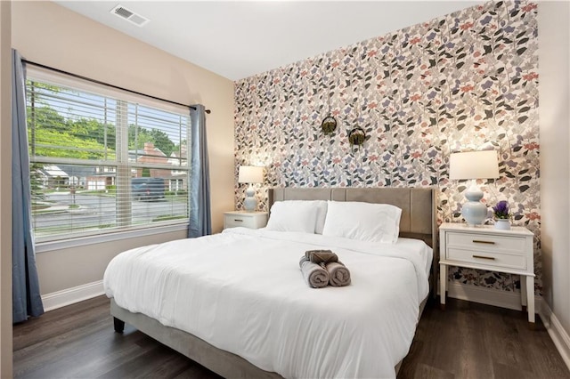 bedroom with dark wood-type flooring