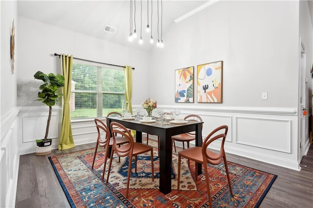 dining area featuring dark wood-type flooring