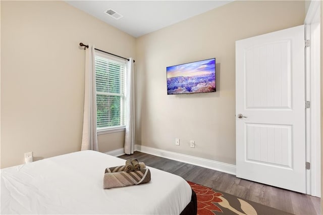 bedroom featuring dark hardwood / wood-style floors