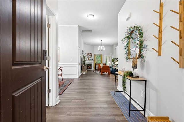 interior space with dark hardwood / wood-style flooring and a chandelier