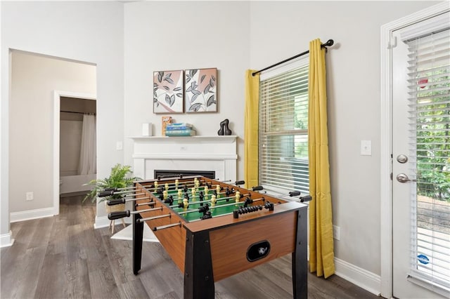 game room with hardwood / wood-style floors and plenty of natural light