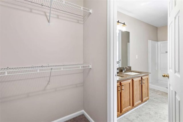 bathroom featuring a bath, visible vents, walk in shower, and a sink