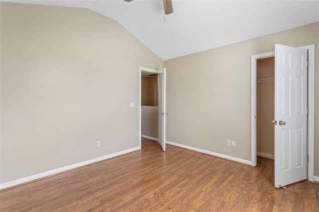 bathroom featuring toilet, baseboards, and vanity