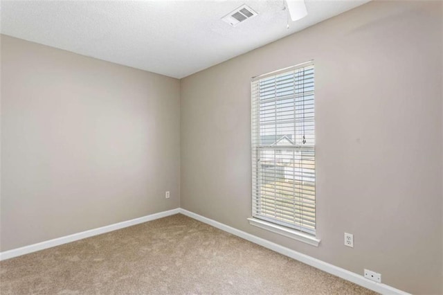 unfurnished bedroom with a closet, carpet flooring, ceiling fan, a textured ceiling, and baseboards