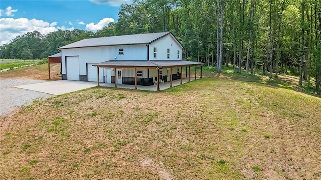 618 W Glade Creek Rd, Clarkesville, GA 30523 - rear view of property featuring driveway, a lawn, metal roof, and a porch