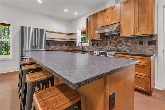 618 W Glade Creek Rd, Clarkesville, GA 30523 - kitchen featuring appliances with stainless steel finishes, under cabinet range hood, open shelves, dark countertops, and healthy amount of natural light
