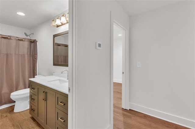 618 W Glade Creek Rd, Clarkesville, GA 30523 - full bathroom with wood finished floors, toilet, vanity, curtained shower, and recessed lighting