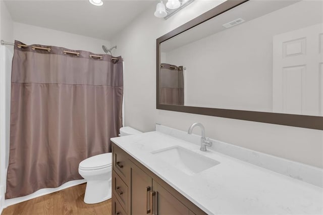 618 W Glade Creek Rd, Clarkesville, GA 30523 - bathroom featuring toilet, vanity, and wood finished floors