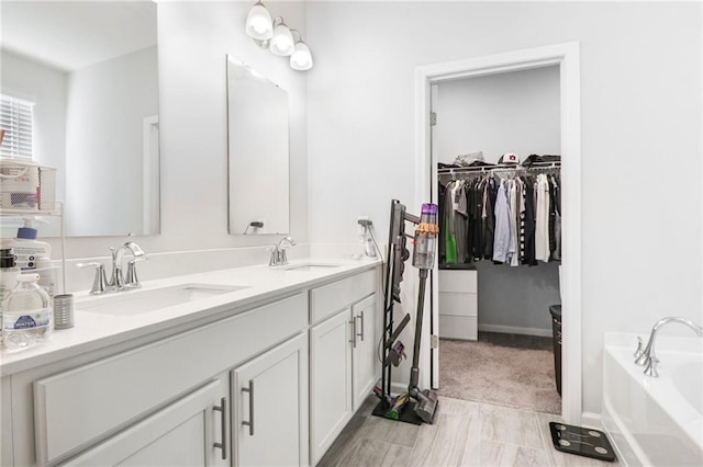 301 Merganser Dr, Pooler, GA 31322 - full bath with a spacious closet, a garden tub, a sink, and double vanity