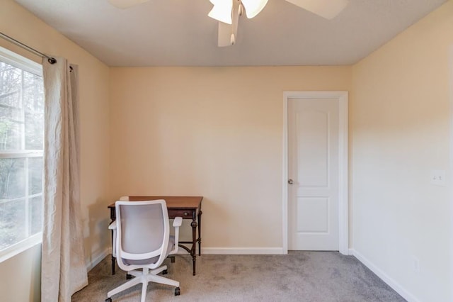 home office featuring baseboards, carpet floors, and a ceiling fan