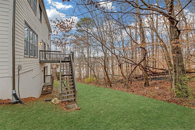 view of yard with stairway and a deck