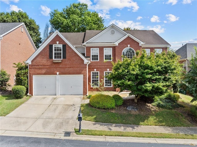 view of front of property featuring brick siding, concrete driveway, and an attached garage