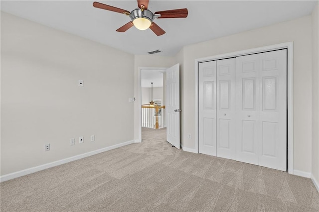 unfurnished bedroom with visible vents, baseboards, ceiling fan, carpet flooring, and a closet