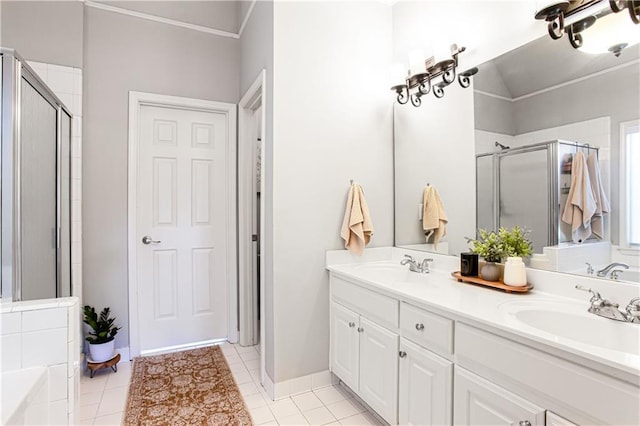 full bathroom with a shower stall, double vanity, tile patterned floors, and a bathtub