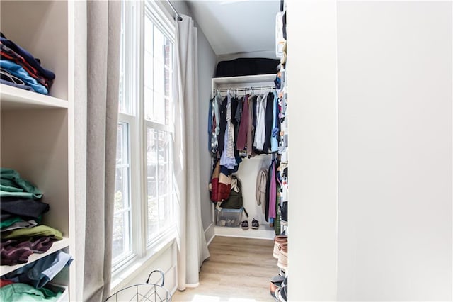 spacious closet featuring light wood-style floors