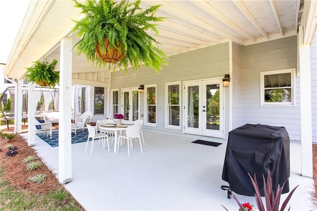 view of patio / terrace featuring french doors, area for grilling, and an outdoor hangout area
