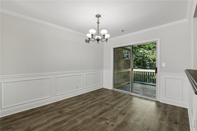 2825 NE Expy NE Unit F003, Atlanta, GA 30345 - unfurnished dining area featuring a chandelier, crown molding, dark wood-type flooring, a wainscoted wall, and a decorative wall