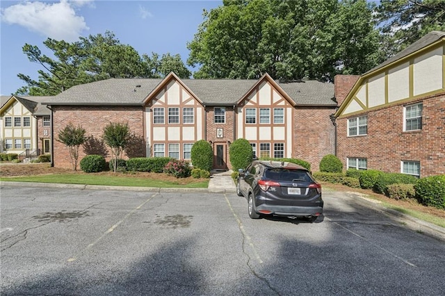 2825 NE Expy NE Unit F003, Atlanta, GA 30345 - view of property featuring uncovered parking