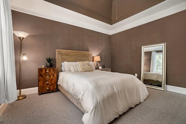 carpeted bedroom featuring baseboards and ornamental molding