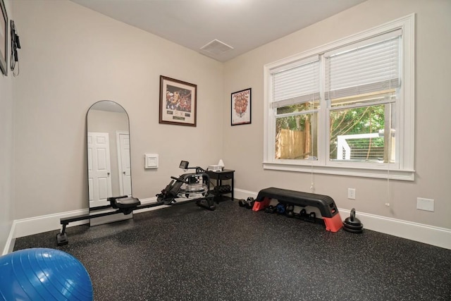exercise room with baseboards