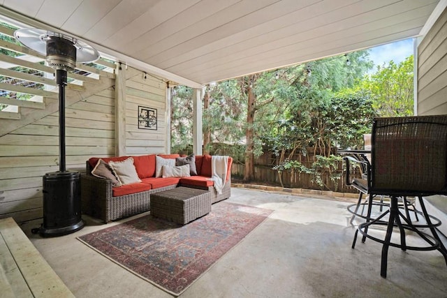 view of patio / terrace with outdoor lounge area and fence