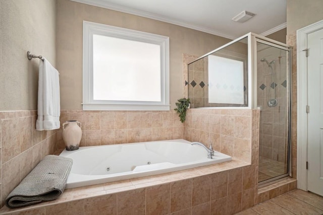 full bath featuring a stall shower, a whirlpool tub, tile patterned floors, and ornamental molding