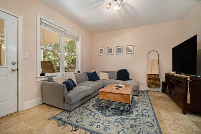 living room with light tile patterned floors and baseboards