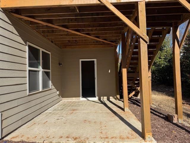 view of patio featuring stairway