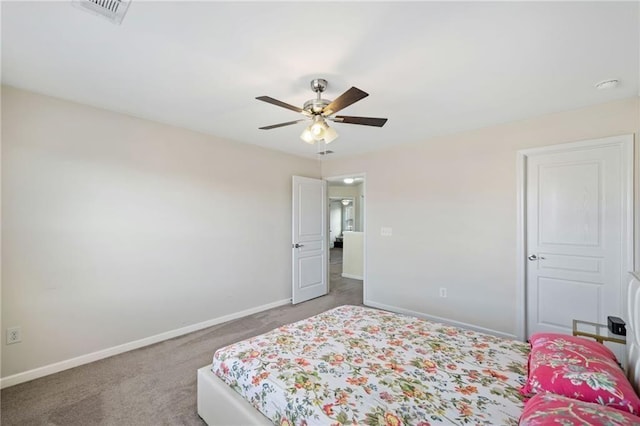 bedroom featuring baseboards, light carpet, and a ceiling fan
