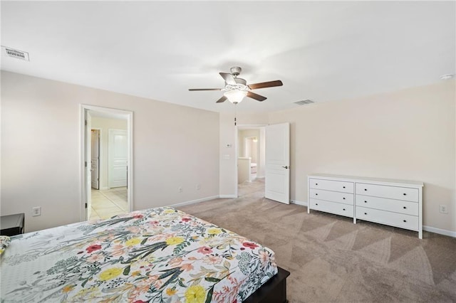 bedroom with light carpet, baseboards, and a ceiling fan