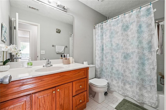 full bathroom with a textured ceiling, tile patterned floors, vanity, toilet, and shower / tub combo