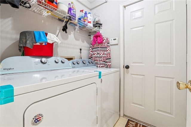 washroom featuring washer and clothes dryer