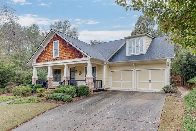 craftsman-style house with a garage and covered porch