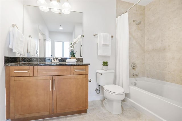 bathroom featuring tile patterned floors, toilet, shower / bath combination with curtain, baseboards, and vanity