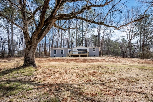 view of front of home featuring crawl space and a deck