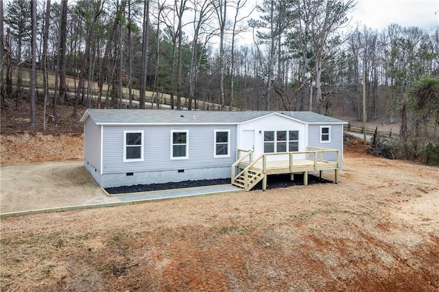 view of front facade with crawl space and a deck