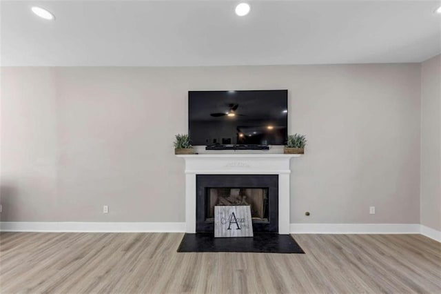 829 Verdun Way, Marietta, GA 30064 - unfurnished living room featuring a fireplace with flush hearth, baseboards, wood finished floors, and recessed lighting