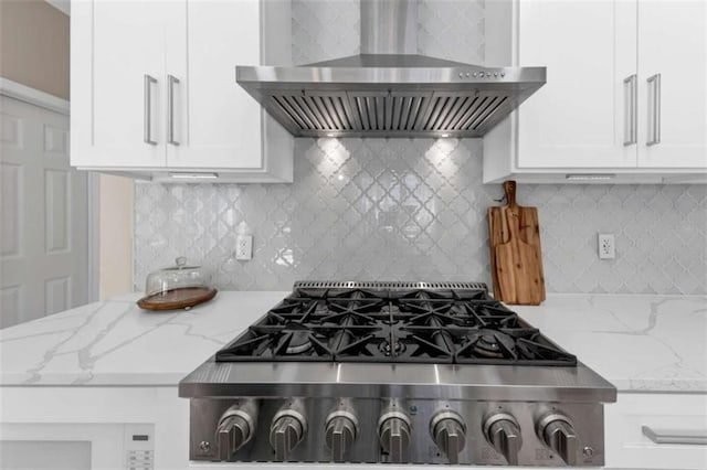 829 Verdun Way, Marietta, GA 30064 - kitchen with decorative backsplash, white cabinetry, light stone counters, and wall chimney range hood