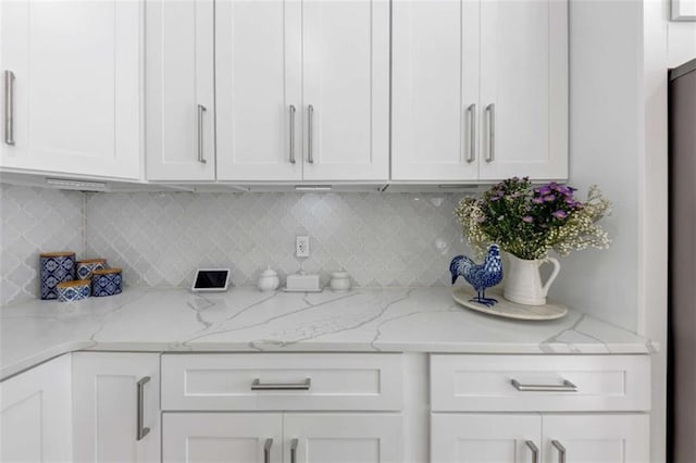 829 Verdun Way, Marietta, GA 30064 - kitchen featuring decorative backsplash, white cabinetry, and light stone countertops