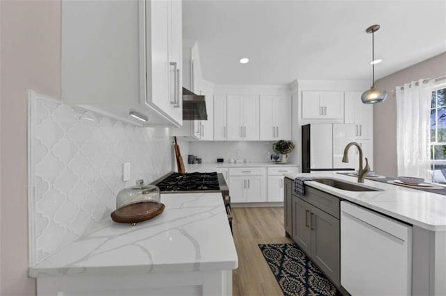 829 Verdun Way, Marietta, GA 30064 - kitchen featuring a sink, white cabinets, extractor fan, white appliances, and backsplash