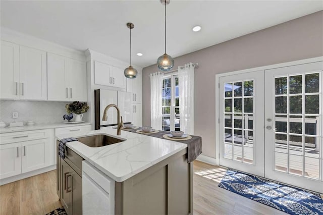 829 Verdun Way, Marietta, GA 30064 - kitchen with french doors, light wood finished floors, a sink, and white appliances
